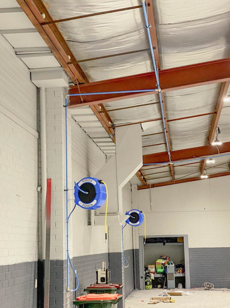 Smash Repair Facility compressed air solutions complete with Macnaught Retracta hose reels.
